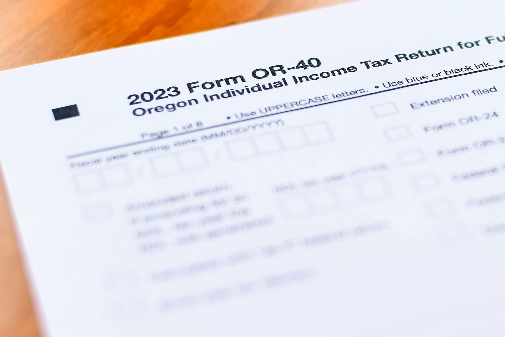 2023 Form OR-40, the Oregon individual income tax return form for full-year residents, sits on a table.